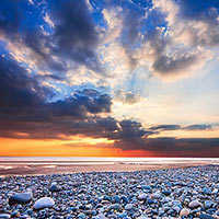 Looking west as the sun sets over the Irish Sea on a warm summer evening.