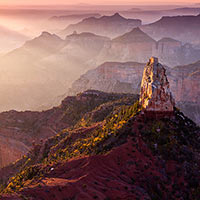 Rays of light cast shadows and illuminate the smoke that has come from the 5 wildfires burning on the canyon rim. 