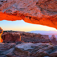 Due to the arch being slightly offset from the cliff and somewhat dependent on the cloud cover at dawn this arch really does glow with a reddish hue for about 15 minutes.