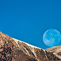 I guess this is a tribute to one of my favorite photographers, Galen Rowell. Moonset over Wheeler Crest.