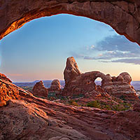Typically shot at sunrise Turret Arch also proves to be a remarkable place to catch a sunset.